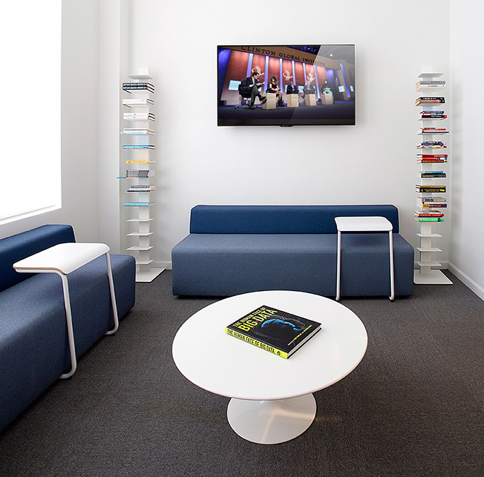 Civic Hall’s library provides an informal meeting area or another choice of workspace. | Featured: k. lounge Collection, Toboggan Pull Up Tables, Saarinen Coffee Table